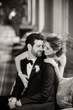 a man and woman sitting next to each other on a couch