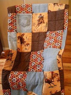 a quilt made to look like an old western blanket