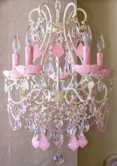 a pink chandelier hanging from the ceiling