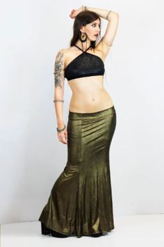 GOLD VINTAGE MERMAID SKIRT This gorgerous metallic mermaid skirt is available in old gold and dark silver colors, perfect to level up any look with this metallic efect. The beautiful mermaid shape makes every body type look gorgerous and stylized.  Perfect for several looks, night outfits, stage and performances, or a more casual extravagant look, your choice! Super elastic and incredibly confortable, it adapts perfectly to all your movements. Long strech mermaid skirt. They can be machine washe Glamorous Long Gold Skirt, Glamorous Gold Long Skirt, Metallic Long Skirt For Night Out, Bohemian Fitted Maxi Skirt For Party, Vintage Stretch Party Skirt, Vintage Stretch Skirt For Party, Glamorous Fitted Skirt For Festival, Fitted Gold Maxi Skirt For Night Out, Elegant Fitted Maxi Skirt For Festival