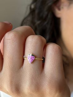 Pink strawberry rings for sweet moments 🍓 Get this beautiful minimalist jewelry made with the quality of perfect elements✨ You can choose 925K Sterling Silver with the options of Gold, Rose Gold or White Gold colors High quality jewelry for everyone 🤍  Details * 925K Sterling Silver → 14K Gold, Rose Gold or White Gold plated * All of the rings we have are adjustable * Time is everything! You will receive your package as soon as possible 🚚  * We care about the quality of metal to make sure it will last for a long time * We use enamel technique to color the jewelry and high quality zircons only * There can be tiny differences on each item. Color changes and shade differences of the stones and enamel is possible since each jewelry piece is unique and special * That beautiful piece will add Dainty Gold Enamel Ring Gift, Dainty 14k Gold Pink Ring, Dainty Pink 14k Gold Ring, Rose Gold Enamel 14k Ring As Gift, Rose Gold 14k Enamel Ring As Gift, Pink Enamel Ring For Valentine's Day Gift, Minimalist Pink Rings For Gift, Pink 14k Gold Heart Ring Gift, Delicate Pink Stackable Rings For Gifts