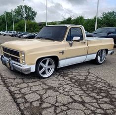 a tan truck parked in a parking lot