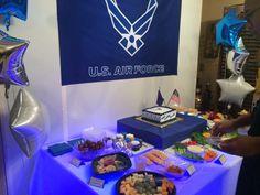 an air force themed party with balloons and desserts