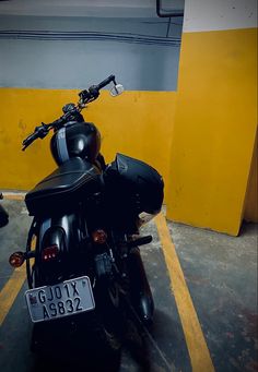 a black motorcycle parked in a parking space