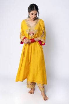 Mustard chanderi A-line kurta with all over vintage pattern, side pockets, contrast metallic zari, sequin, thread embroidered yoke and sleeve borders. - Aza Fashions Festive Anarkali Tunic Palazzo Set, Anarkali Style Palazzo Set For Navratri, Festive Anarkali Tunic With Dupatta, Festive Straight Kurta Tunic With Dupatta, Traditional Yellow Tunic For Festive Occasions, Festive Straight Kurta Tunic For Wedding, Festive Wedding Straight Kurta Tunic, Festive Wedding Tunic Straight Kurta, Festive Anarkali Tunic For Festivals