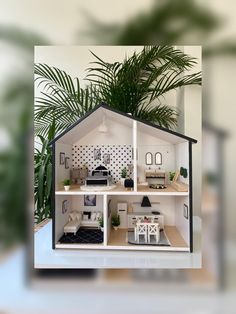 a doll house with furniture and plants in it