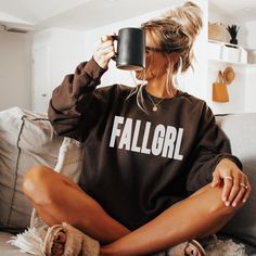 Calling all fall-loving girls--your new favorite sweatshirt has arrived! 🍂 Our FALLGRL sweatshirt is the ultimate must-have for anyone who lives for pumpkin spice, crisp air, and cozy nights. This trendy design combines comfort and style, making it perfect for everything from pumpkin patch visits to bonfire hangouts.  Don't just dream about fall--live it in the FALLGRL sweatshirt and make this your best autumn season yet! 🍁 A sturdy and warm sweatshirt bound to keep you warm in the colder months. A pre-shrunk, classic fit sweater that's made with air-jet spun yarn for a soft feel and reduced pilling. * 50% cotton, 50% polyester * Pre-shrunk * Classic fit * 1x1 athletic rib knit collar with spandex * Air-jet spun yarn with a soft feel and reduced pilling * Double-needle stitched collar, s Cute College Tops For Fall, Cozy Fall Tops For College, Cute Fall Loungewear Sweatshirt, Cute Fall Letter Print Sweatshirt, Cute Letter Print Sweatshirt For Fall, Fall Apparel, Fall Shirts Women, Sweater Autumn, Cozy Season