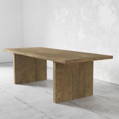 a large wooden table sitting on top of a white tiled floor next to a wall