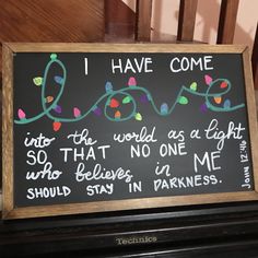 a chalkboard sign that says i have come into the world as a light and so that no one in me should stay in darkness