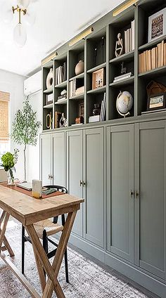 a living room filled with furniture and bookshelves