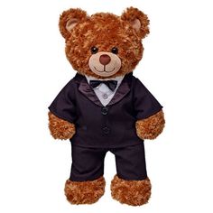 a brown teddy bear wearing a suit and tie