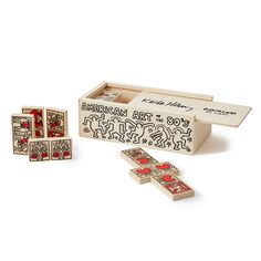 an assortment of wooden playing cards in a box