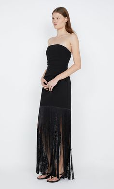 The BEC + BRIDGE Wilder Fringe dress is a classic wardrobe essential with a twist. Designed with a classic strapless neckline and bodice that hugs the silhouette, the dress is finished with a dramatic fringed hemline that begins from the mid-thigh. Elegant Strapless Dress With Fringe, Elegant Tasseled Evening Dress, Elegant Strapless Fringe Dress, Elegant Fringe Cocktail Evening Dress, Elegant Fringe Dress For Gala, Sleeveless Fringe Evening Dress For Night Out, Sleeveless Fringe Evening Dress, Elegant Fitted Dress With Tassels, Elegant Fringed Party Evening Dress