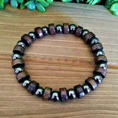 This Is A Men's Beaded Bracelet With Dark Brown "Real Wood" And Hematite Beads. The Wood Beads Are Round And Cylinder-Shaped. The Bracelet Is Made With Strong And Durable Elastic That Allows It To Easily Stretch Over Your Hand To Your Wrist. Multiple Sizes Available The Bracelet Can Be Made Any Size So Women Can Wear Too. Message Me If You Need Another Size The Diameter On The Wood Bead Is 10mm And The Hematite Is 8mm. The Bracelet Is Ready For Gift Giving Fast Shipping Adjustable Hematite Bracelets, Casual Round Beaded Hematite Bracelets, Adjustable Wooden Beaded Bracelet, Mens Stretch Bracelets, Crystal Diy, Wood Bead Bracelet, Hematite Bracelet, Grey Beads, Diy Crystals