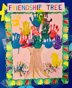 a child's handprint tree is displayed on a bulletin board with the words, friendship tree