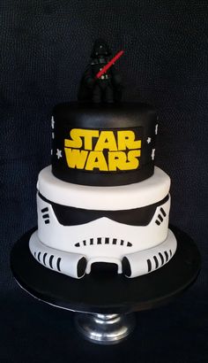 a star wars themed cake on a black table