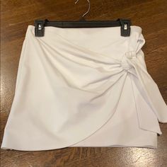 White Forever 21 Skirt Size: Medium Never Worn White Pencil Skirt Skort For Summer, White Asymmetrical Lined Skort, White Asymmetrical Skort For Spring, White Asymmetrical Chic Skort, Chic White Asymmetrical Skort, Forever 21 Elegant Mini Skirt For Spring, Elegant Spring Mini Skirt By Forever 21, Elegant Forever 21 Mini Skirt For Spring, Spring Elegant Forever 21 Mini Skirt