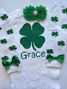 *CURRENT PROCESSING TIME: 3-6 business days before shipment* Perfect outfit for baby's 1st St. Patrick's Day! Choose from 1 or all 3 items. Pieces may include: 1. Short OR long sleeved Personalized clover bodysuit with an adorable clover-bottom 2. Clover legwarmers with green bows. ATTN: WILL BE LARGE on babies under 15lbs, but can be rolled 3. Shabby flower headband with two green flowers adorned with a white pearl-like middle set on a 1/8 inch white elastic. WHEN ORDERING, please include name Newborn St Patricks Day, Clover Outfit, St Patrick's Day Outfit, Baby Girl Outfit, St. Patricks Day, Shabby Flowers, Personalized Baby Girl, Heat Press Machine, Green Bows