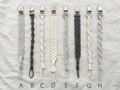 five different types of braiding on a white sheet with black and grey colors,