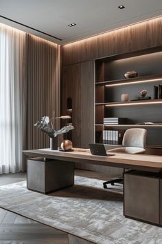 a desk with a laptop on top of it in front of a book shelf and bookshelf