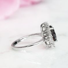 Gorgeous Gray Diamond Vintage Inspired Ring ►Made of solid sterling silver with rhodium finish (925) ►Accented With Simulated Diamonds (CZ) ►Average band width: 1.8 mm Center Stone: Gray Cubic Zirconia Shape: Oval Measurements: 7.0 x 9.0 mm Carat Weight: 1.4 ct. (approx.) Hardness: 9 (Mohs scale) ✓ 100% Nickel-Free ✓ Hypoallergenic ✓ Comfort Fit ✓ Free Ring Box ✓ Free USA Shipping ✓ Ready to ship next business day Classic Halo Setting Birthstone Ring For Proposal, Classic Formal Flower Ring With Halo Design, Classic Halo Crystal Ring For Formal Occasions, Classic Oval Flower Promise Ring, Classic Marquise Cut Halo Ring Gift, Classic Flower Ring With Halo Setting For Promise, Classic Sapphire Ring With Halo For Anniversary, Classic Flower Ring With Halo Setting For Gift, Classic Flower Ring With Halo Setting As Gift