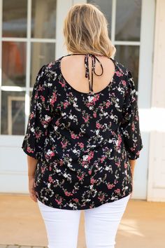 The love we have for this top is rare and special! We love the neutral black color that can be paired with so many bottoms! The floral pattern is perfect for warm weather and the open tie back is so chic! Style this with some white skinnies and your best sandals for a stylish look! 100% Polyester Black Tie Back Top For Day Out, Black Tie-back Top For Beach, White Skinnies, Model Fits, Tie Backs, Tie Back, Warm Weather, Chic Style, Black Color