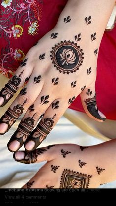 two women with henna tattoos on their hands