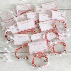 many bracelets with thank you tags on them