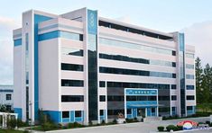 an office building with blue trim and windows