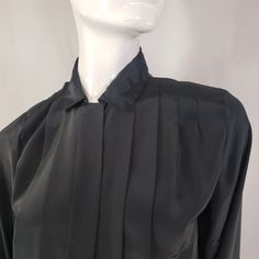 "by Kristin, black blouse with hidden buttons panel and front pleats. Fits Medium 19\" across 23\" long 23\" sleeves * Please review all shop policies before completing transaction. All sales final. No returns or exchanges. * Bundle up for combined shipping. * Instagram @vintagerunsdeepshop" Elegant Collared Pleated Blouse, Elegant Pleated Collared Blouse, Formal Fitted Blouse With Pleated Sleeves, Elegant Pleated Evening Blouse, Elegant Pleated Blouse For Evening, Formal Collared Blouse With Pleated Sleeves, Long Sleeve Pleated Shirt For Work, Classic Pleated Blouse For Fall, Pleated Long Sleeve Shirt For Work