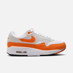 Style No. DZ2628-002 Color: Neutral Grey/White/Black/Safety Orange Meet the leader of the pack. Walking on clouds above the noise, the Air Max 1 blends timeless design with cushioned comfort. Sporting a fast-paced look, wavy mudguard and Nike Air, this classic icon hit the scene in ‘87 and continues to be the soul of the franchise today. Nike Air Max 1 Women's Shoes. Leader Of The Pack, Classic Icon, Red Puffer, On Clouds, Walking On Clouds, Air Max Women, Fast Paced, Air Max 1, Walk On