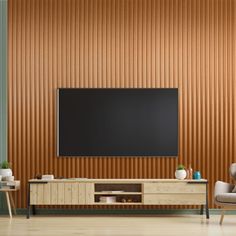 an empty living room with two chairs and a television on the wall in front of it