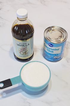 ingredients to make vanilla ice cream sitting on a counter