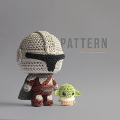 a crocheted star wars character and baby yoda