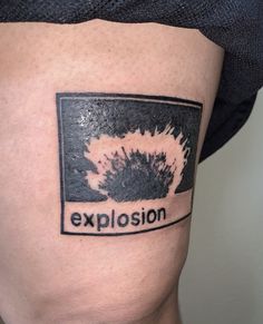 a close up of a person's thigh with an explosion tattoo on the side