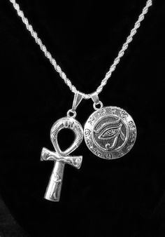 Silver Plated Ankh & Eye of Horus Duo Charm Necklace Choose YOUR chain! Large Ankh Charm measures 1.75 inches high Ankh is 0.75 inches wide Stainless Steel--with Silver Plating. Eye of Horus charm is 30 mm about the size of a USA Quarter. Horus charm is hollow on backside. Choose your chain from our pull-down menu above: A } a 925 Sterling Silver ROPE chain 2mm wide by 45 cm long (about 17.7 inches) OR b} a Silver ROPE Chain 2mm/ 50 cm = 19.7 inches with lobster clasp. Eco-Gift packaged. USA Ankh Necklace, Silver Rope Chain, Diy Charm Bracelet, Egyptian Jewelry, Eye Of Horus, Dope Jewelry, Red Jewelry, Zodiac Jewelry, Jewelry Lookbook