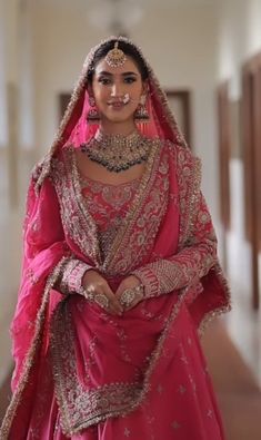 a woman in a pink bridal gown