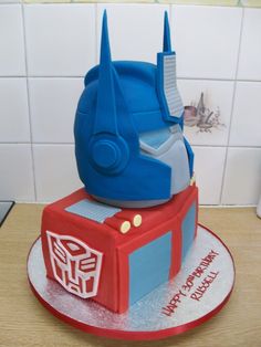 a birthday cake made to look like a transformer head on top of a table