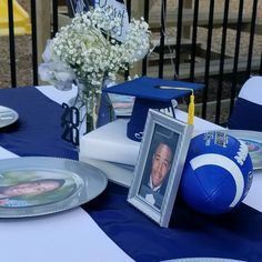 a table topped with blue and white decorations