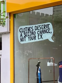 there is a sign in the window that says clothes deserves a second chance, not your ex