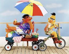 two cartoon characters are sitting on a bench with an umbrella over their head and one is riding a bike