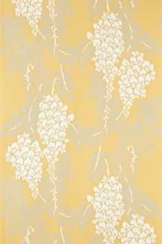 a yellow and grey wallpaper with white flowers on the top, in front of a beige background