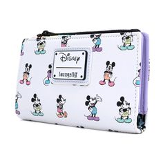 Join the classic Mickey in this pastel All Over Print wallet. Featuring a rainbow design in the inside. Dimensions: W: 6" X H: 4" Material: Faux leather (polyurethane) Features: Wallet has snap fastener, shiny metal hardware, 7 card slots, clear ID holder and zippered coin pocket. This wallet is an officially licensed Disney product. Mickey Mouse Gifts, Disney Wallet, Mickey Mouse Theme, Disney Handbags, Retro Accessories, Loungefly Disney, Travel Wallets, Coin Pouch, Disney Mickey Mouse