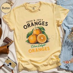 Comfort Colors® Citrus Oranges Cottagecore Shirt Aesthetic Fruit T-Shirt Retro Local Farmers Market Fruity Tee Summer Orange Print Top Gift Trendy Fruit Shirt S Up to 4XL Our Comfort Colors® t-shirt is a soft-washed, garment-dyed fabric that brings extra coziness to your wardrobe while the relaxed fit makes it an excellent daily choice. The double-needle stitching throughout the tee makes it highly durable while the lack of side-seams helps the shirt retain its tubular shape. *Original design *R Retro Orange T-shirt For Spring, Vintage Orange Summer Shirt, Summer Orange T-shirt With Graphic Print, Trendy Summer T-shirt With Fruit Print, Trendy Fruit Print T-shirt For Summer, Fruit Shirt, Cottagecore Shirt, Local Farmers Market, Orange T Shirts