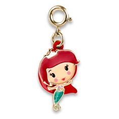 a little mermaid charm with a red hat on it's head and a green tail