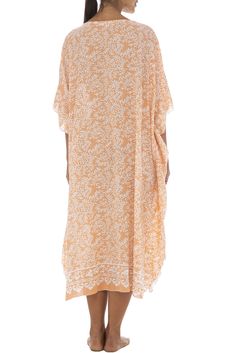 Soft as a daydream, this flowing poncho style black dress sweetens your summer downtime with its light flowing fabric and pastel buttermint hues. Handmade design features a pretty batik floral print, as well as butterfly sleeves that mirror the easy mid-calf hemline. Generously sized to provide ample coverage for womens regular to plus sizes; wear as a beach caftan, lounge dress or maxi cover up for swimwear. Back From Bali is dedicated to creating beautiful, quality clothing with a heart. All o Spring Maxi Length Cover-up For Daywear, Spring Daywear Maxi-length Cover-up, Spring Daywear Maxi Length Cover-up, Vacation White Maxi Dress With 3/4 Sleeve, Casual Half Sleeve Maxi Dress For Beach, Casual Half-sleeve Maxi Dress For Beach, White 3/4 Sleeve Maxi Dress For Vacation, White Maxi Dress With 3/4 Sleeves For Vacation, Orange Spring Kaftan With Kimono Sleeves