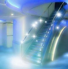 an escalator in the middle of a blue room