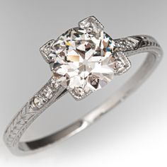 This fantastic circa 1930s ring features engraved wheat motif detail and is bordered with milgrain edging. The ring is centered with one (1) old European cut diamond weighing 1.21 carats that is set into a four-prong setting. The shoulders of the ring are each accented with three (3), bead set, round single cut diamonds. The ring measures 7.1mm at the top, rises 4.9mm above the finger, tapering to 1.1mm wide and 0.8mm thick at the base of the shank. It is currently a size 7. German Engagement Ring, 1930s Ring, European Cut Diamond Engagement Ring, Engagement Ring Platinum, Peridot Jewelry, Antique Diamond Rings, Diamond Engagement Rings Vintage, 1930s Art, Simple Engagement Rings