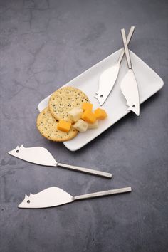 Ratoncito mouse shaped knives/cheese spreaders in the nascent steel Jason design. A whimsical and helpful touch to your cheese platters. Friends Gathering, Polished Stainless Steel