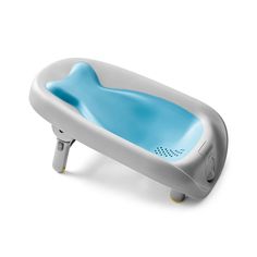 the baby bathtub is sitting on wheels and has a blue seat in front of it